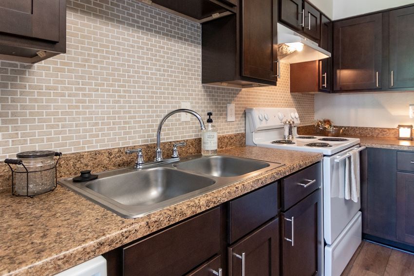 This is a photo of the kitchen of the 590 square foot 1 bedroom, 1 bath model apartment at The Biltmore Apartments located int he Vickery Meadow neighborhood of Dallas, TX.