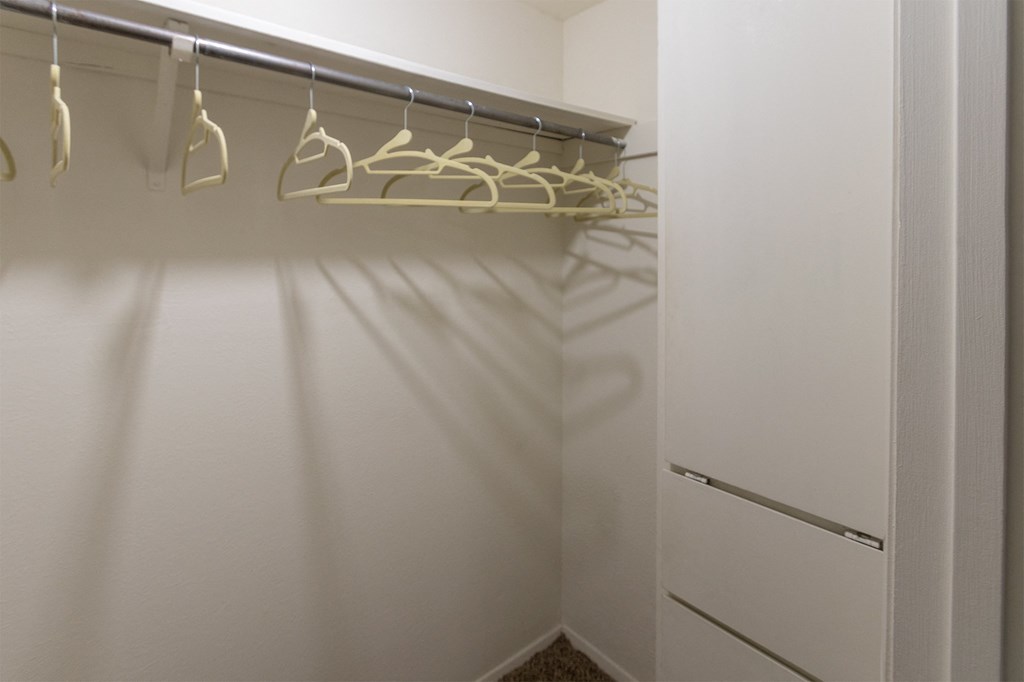hallway walk-in closet with built-in shelving  at The Biltmore, Dallas, TX, 75231