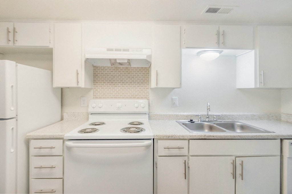 Kitchen With White Appliances at The Biltmore, Dallas, Texas