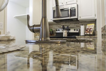 This is a photo of the kitchen of a 1245 square foot 2 bedroom apartment at Cambridge Court Apartments in Dallas, TX. - Photo Gallery 2
