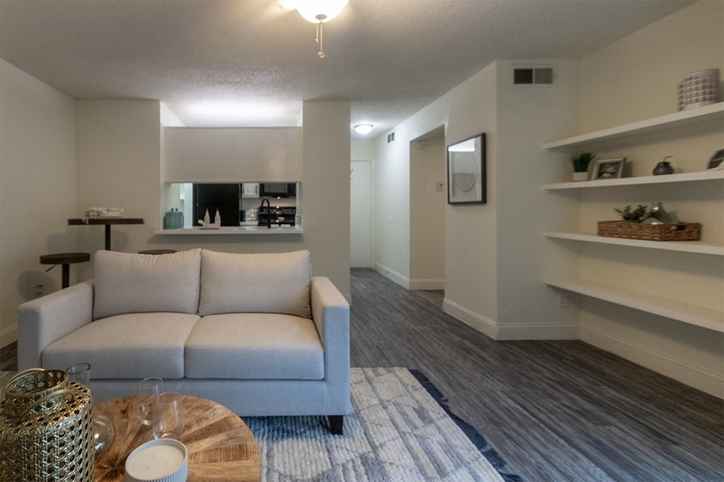 This is a photo of the living room in a 692 square foot 1 bed, 1 bath model aprtment at Cambridge Court Apartments in Dallas Texas