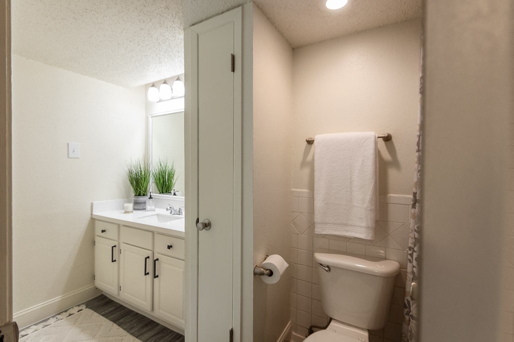 This is a photo of the bathroom in a 692 square foot 1 bed, 1 bath model aprtment at Cambridge Court Apartments in Dallas Texas