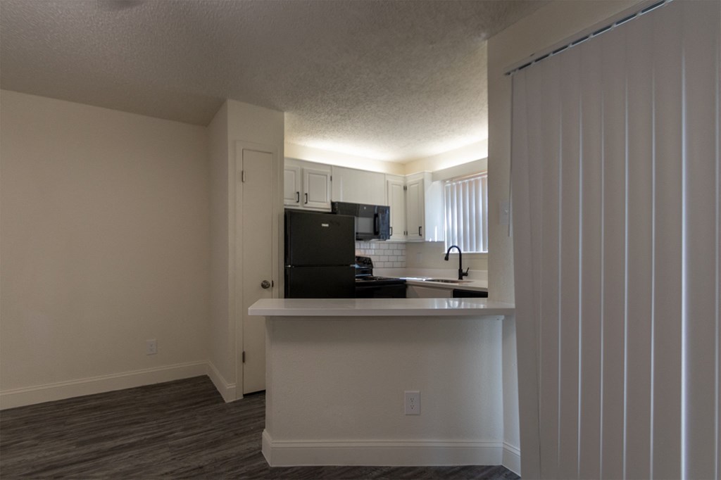 This is a photo of the kitchen in the 450 square foot efficiency apartment at Cambridge Court Apartments in Dallas, TX.