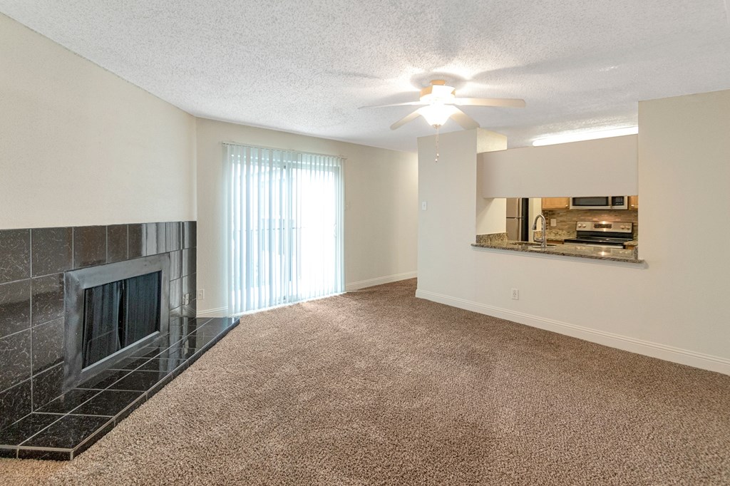 This is a photo of the living room in the 982 square foot 1 bedroom, 1 bath apartment at Cambridge Court Apartments in Dallas, TX.