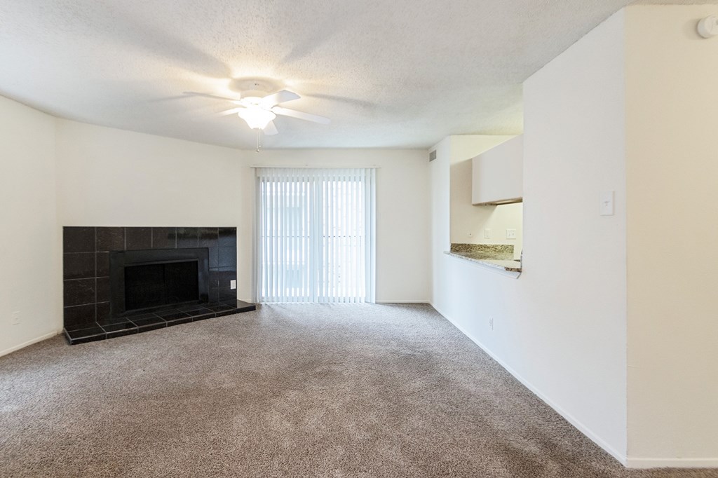 This is a photo of the living room in the 1245 square foot 2 bedroom, 2 bath apartment at Cambridge Court Apartments in Dallas, TX.