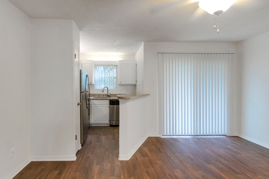 This is a photo of the living area in the 445 square foot efficiency apartment at Cambridge Court Apartments in Dallas, TX.