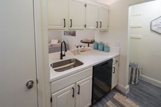 Photo of the kitchen in a 692 square foot 1 bed, 1 bath model aprtment at Cambridge Court Apartments in Dallas Texas