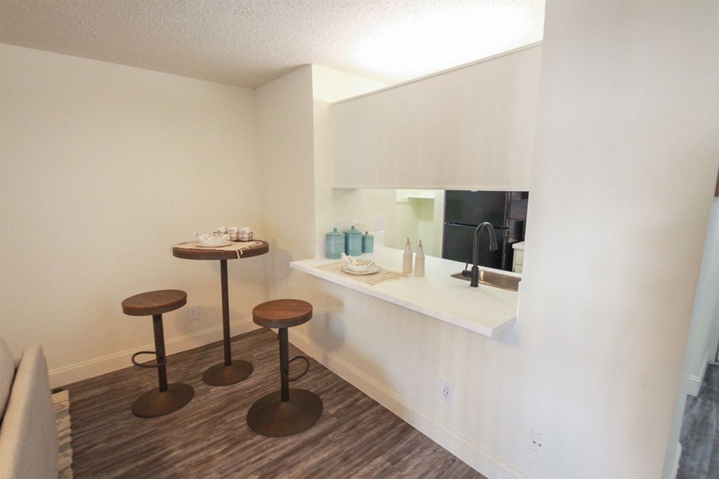 Photo of the dining area in a 692 square foot 1 bed, 1 bath model aprtment at Cambridge Court Apartments in Dallas Texas