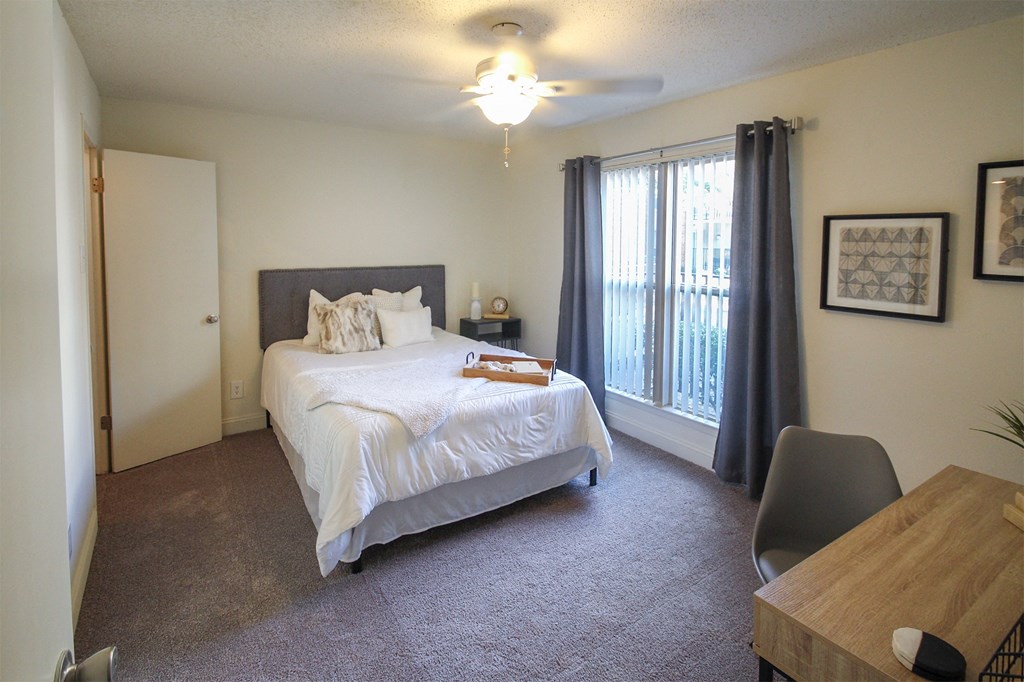 Photo of the bedroom in a 692 square foot 1 bed, 1 bath model aprtment at Cambridge Court Apartments in Dallas Texas