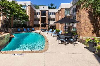 This is a photo of the primary pool area at Cambridge Court Apartments in Dallas, TX.