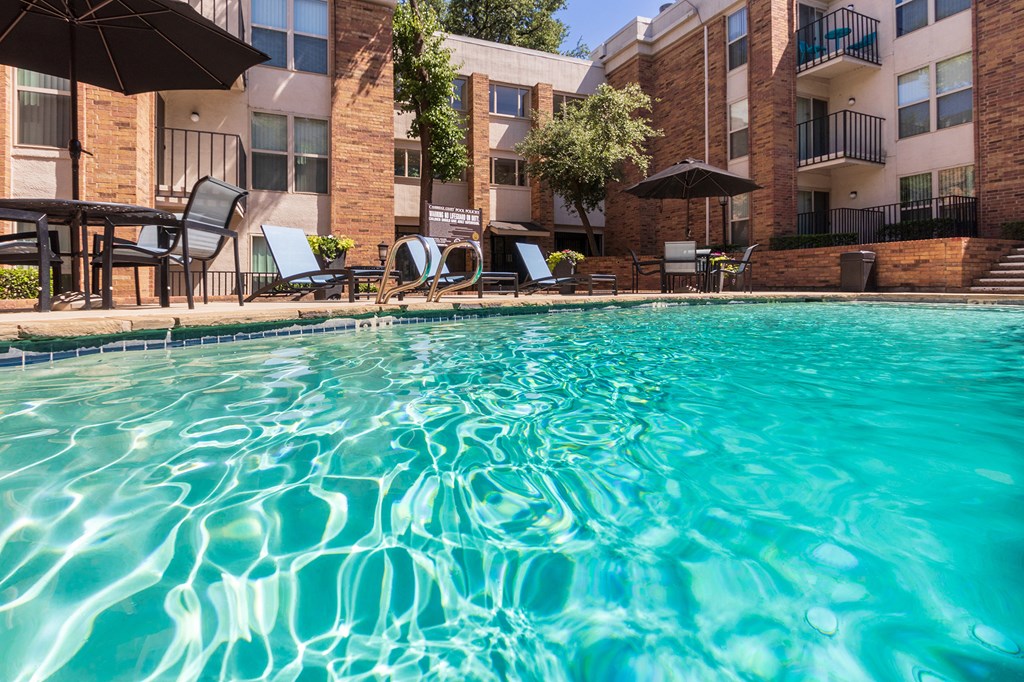 This is a photo of the primary pool area at Cambridge Court Apartments in Dallas, TX.