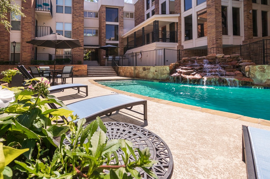 This is a photo of the primary pool area at Cambridge Court Apartments in Dallas, TX.
