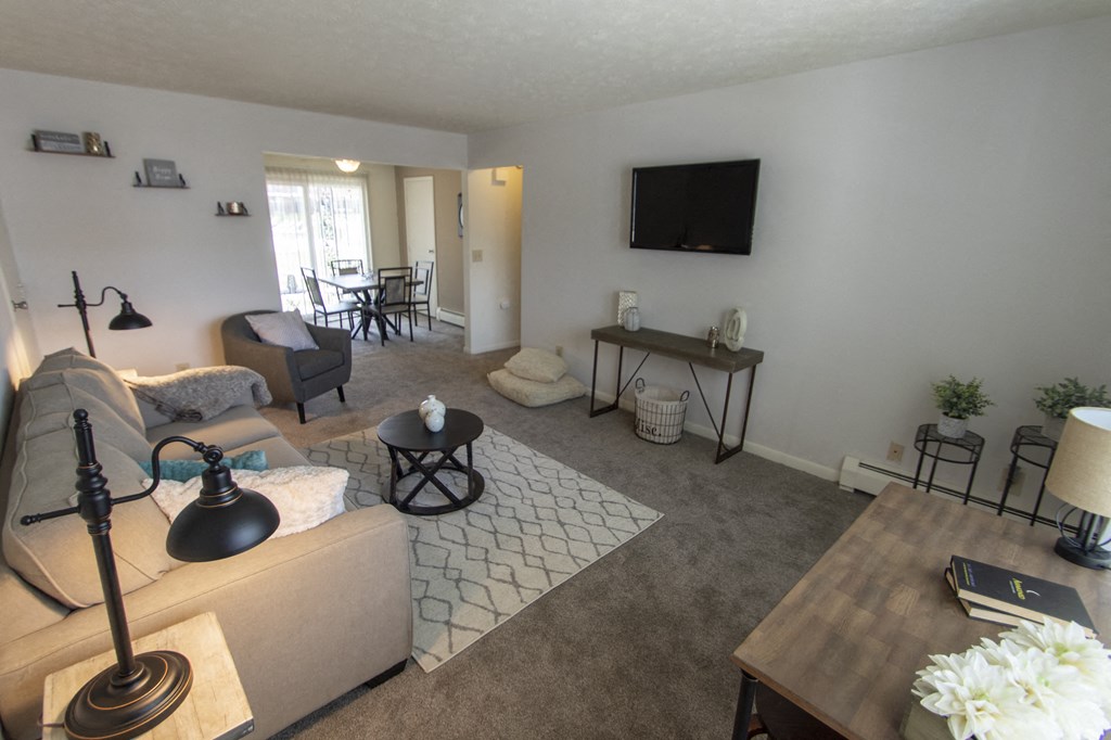 This is a photo of the living room in the 740 square foot 1 bedroom model apartment at Compton Lake Apartments in Mt. Healthy, OH.