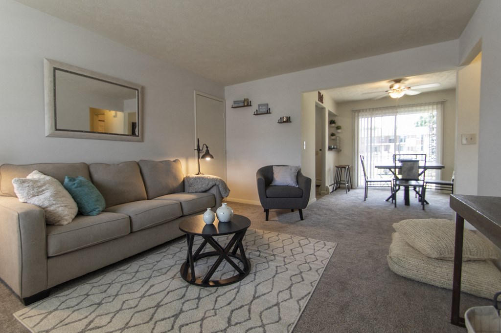 This is a photo of the living room in the 740 square foot 1 bedroom model apartment at Compton Lake Apartments in Mt. Healthy, OH.