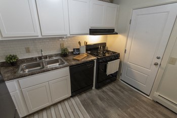 This is a photo of the kitchen in the 740 square foot 1 bedroom model apartment at Compton Lake Apartments in Mt. Healthy, OH. - Photo Gallery 2