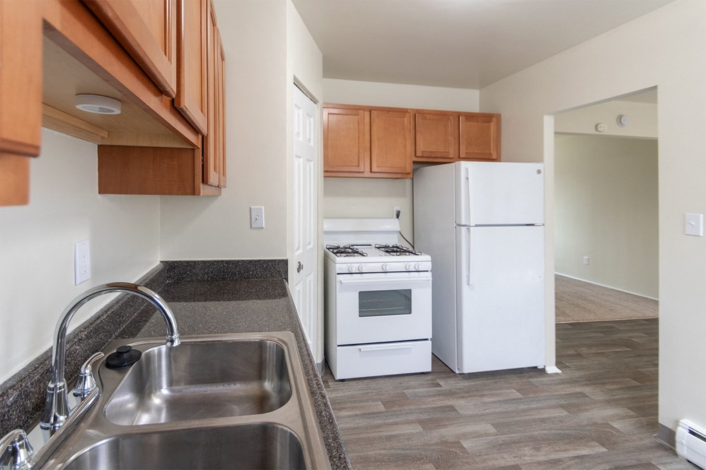 This is a photo of the kitchen of the 1004 square foot, 2 bedroom/1 bath Townhome with stackable washer/dryer floor plan at Colonial Ridge Apartments in the Pleasant Ridge neighborhood of Cincinnati, OH.