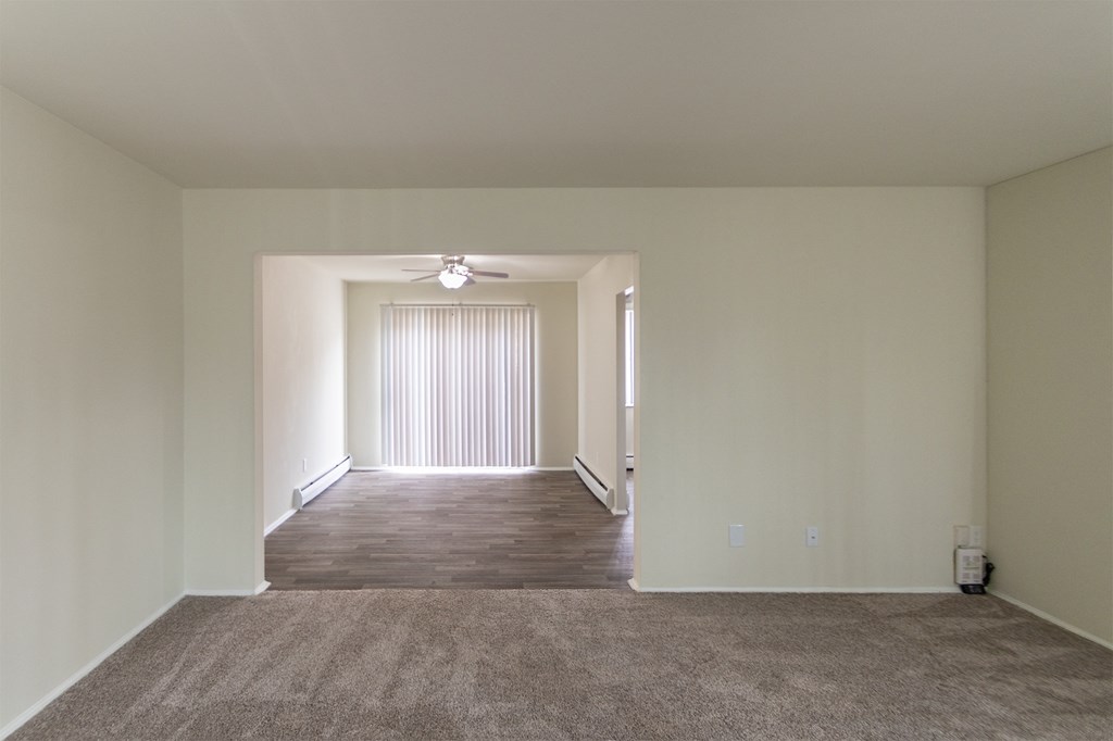 This is a photo of the dining room from the living room of the 1004 square foot, 2 bedroom/1 bath Townhome with stackable washer/dryer floor plan at Colonial Ridge Apartments in the Pleasant Ridge neighborhood of Cincinnati, OH.