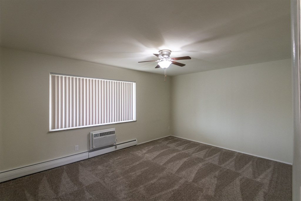 This is a photo of the primary bedroom of the 1004 square foot, 2 bedroom/1 bath Townhome with stackable washer/dryer floor plan at Colonial Ridge Apartments in the Pleasant Ridge neighborhood of Cincinnati, OH.