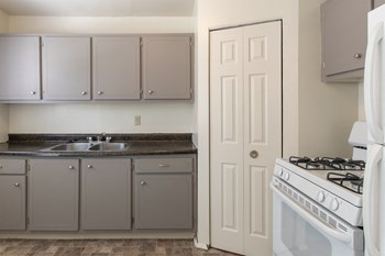 This is a photo of the kitchen in the 1004 square foot, 2 bedroom townhome floor plan at Colonial Ridge Apartments in the Pleasant Ridge neighborhood of Cincinnati, OH. - Photo Gallery 2