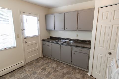 This is a photo of the kitchen in the 1004 square foot, 2 bedroom townhome floor plan at Colonial Ridge Apartments in the Pleasant Ridge neighborhood of Cincinnati, OH.