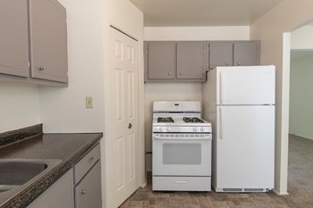 This is a photo of the kitchen in the 1004 square foot, 2 bedroom townhome floor plan at Colonial Ridge Apartments in the Pleasant Ridge neighborhood of Cincinnati, OH. - Photo Gallery 3