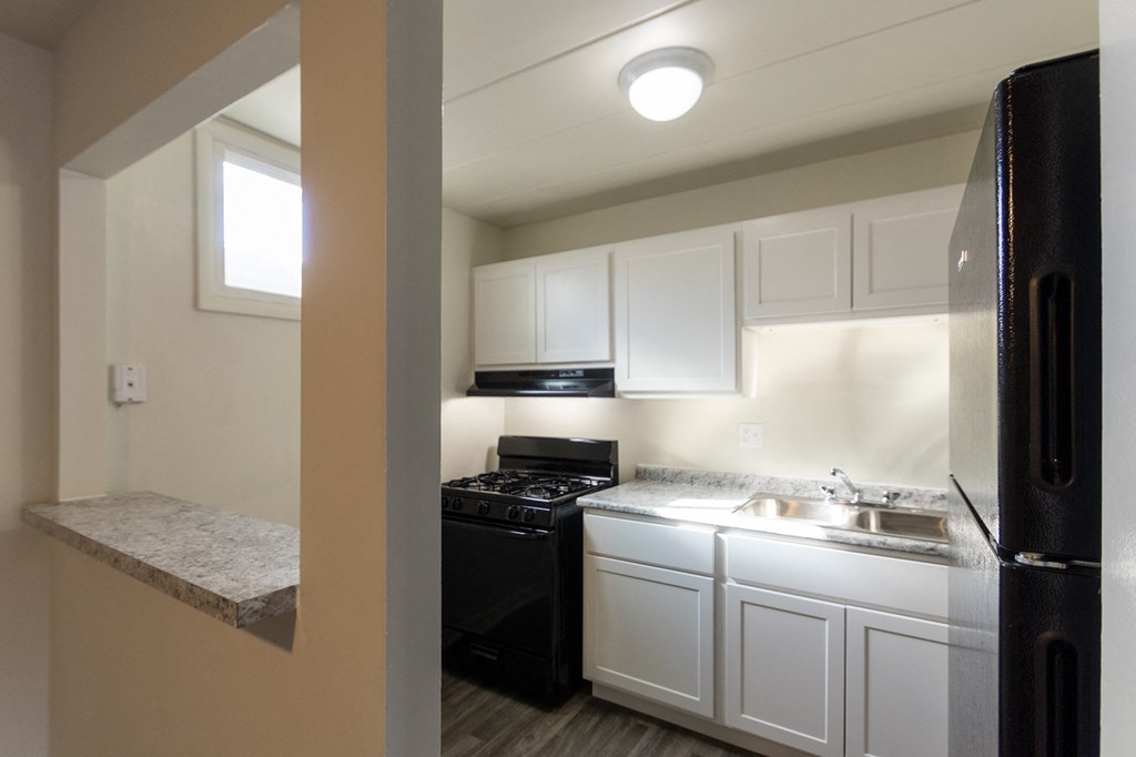 This is a photo of the kitchen in the 550 square foot 1 bedroom, 1 bath patio apartment at College Woods Apartments in the North College Hill neighborhood of Cincinnati, OH.
