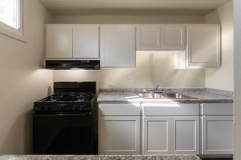 This is a photo of the kitchen in the 550 square foot 1 bedroom, 1 bath patio apartment at College Woods Apartments in the North College Hill neighborhood of Cincinnati, OH. - Photo Gallery 4
