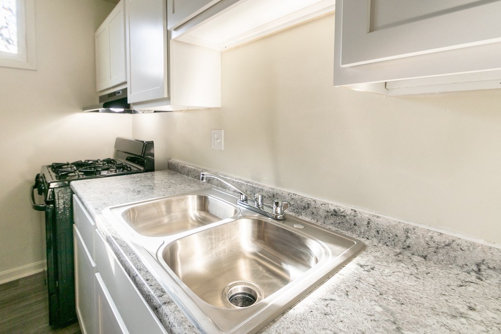 This is a photo of the kitchen in the 550 square foot 1 bedroom, 1 bath patio apartment at College Woods Apartments in the North College Hill neighborhood of Cincinnati, OH.