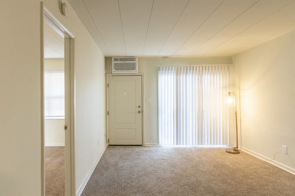 This is a photo of the living room in the 550 square foot 1 bedroom, 1 bath patio apartment at College Woods Apartments in the North College Hill neighborhood of Cincinnati, OH.
