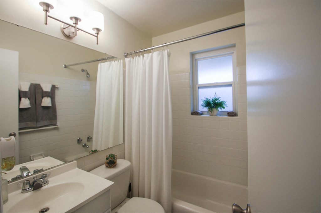 This is a photo of the bathroom of the 550 square foot 1 bedroom, 1 bath, balcony floor plan model apartment at College Woods Apartments in Cincinnati, OH.