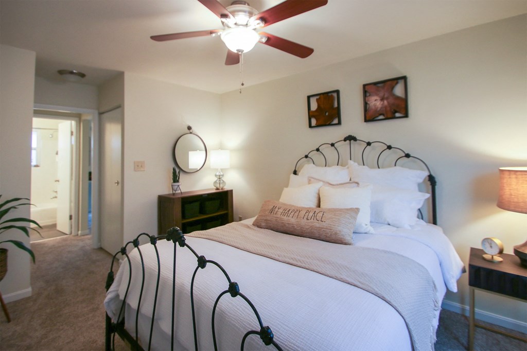 This is a photo of the bedroom of the 550 square foot 1 bedroom, 1 bath, balcony floor plan model apartment at College Woods Apartments in Cincinnati, OH.