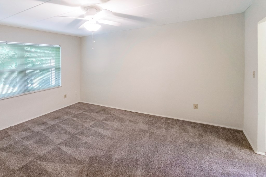 This is a photo of the bedroom of the 550 square foot 1 bedroom, 1 bath patio apartment at College Woods Apartments in the North College Hill neighborhood of Cincinnati, OH.