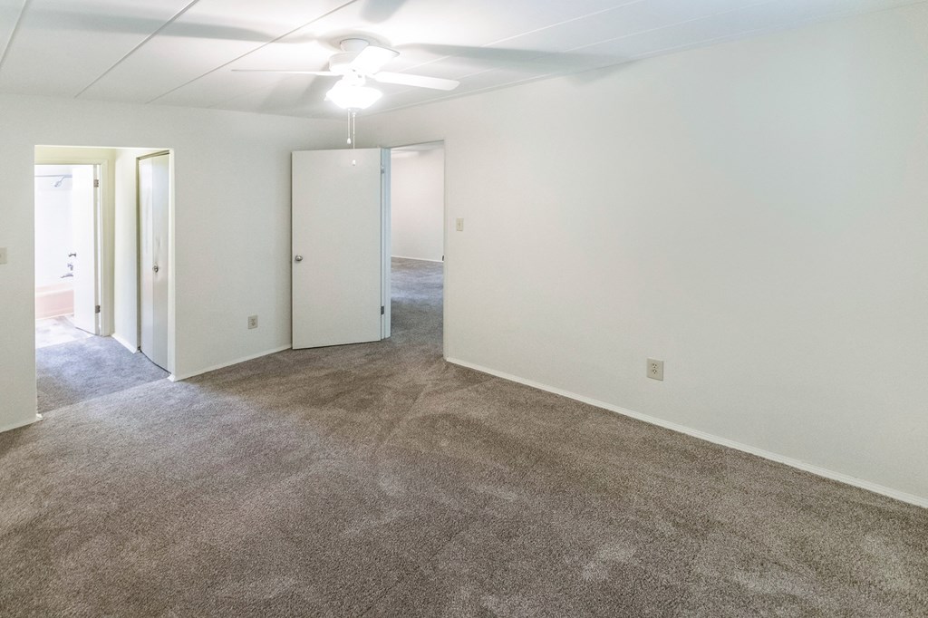 This is a photo of the bedroom of the 550 square foot 1 bedroom, 1 bath patio apartment at College Woods Apartments in the North College Hill neighborhood of Cincinnati, OH.