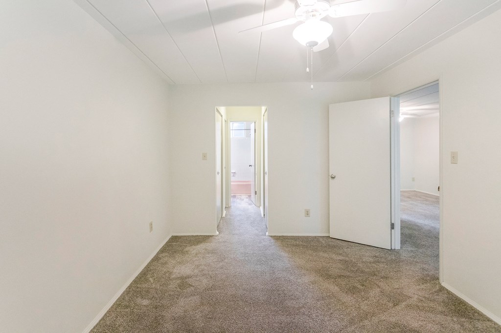 This is a photo of the bedroom of the 550 square foot 1 bedroom, 1 bath patio apartment at College Woods Apartments in the North College Hill neighborhood of Cincinnati, OH.
