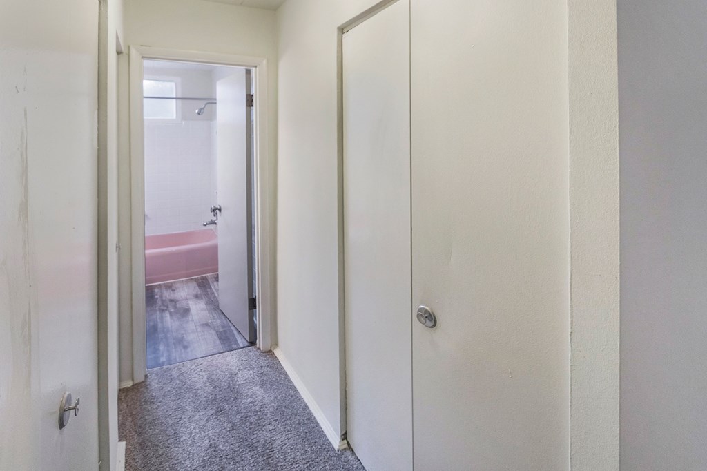 This is a photo of the hallway leading to the bathroom in the 550 square foot 1 bedroom, 1 bath patio apartment at College Woods Apartments in the North College Hill neighborhood of Cincinnati, OH.