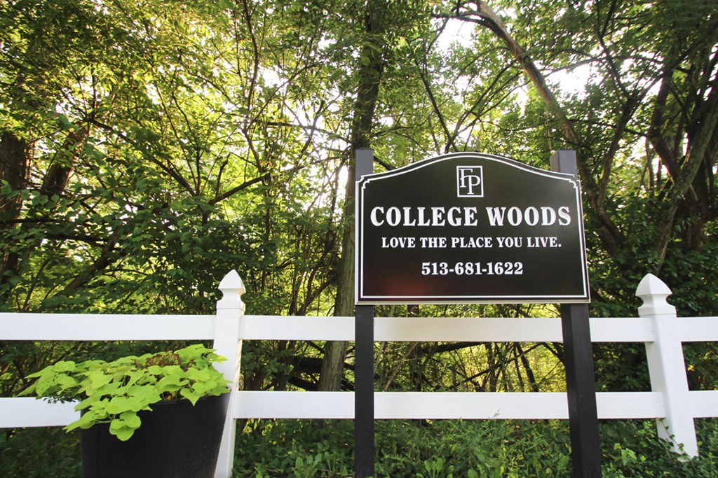 This is a photo of the entrance sign at College Woods Apartments in Cincinnati, OH.