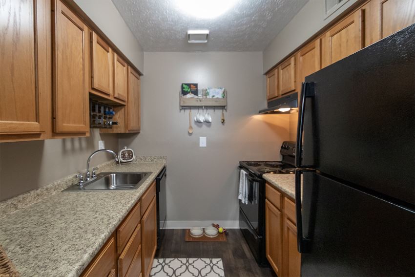 This is a photo of the kitchen in the upgraded 650 square foot, 1 bedroom, 1 bath model apartment at Deer Hill Apartments in Cincinnati, Ohio.
