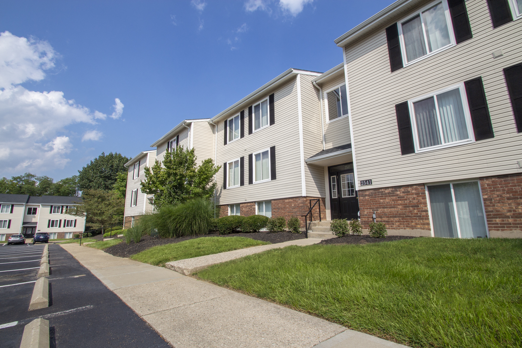 This is a picture looking down a row of apartment entrances at Deer Hill Apartments in Cincinnati, Ohio.