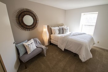 This is a picture of the primary bedroom in an upgraded 980 square foot, 2 bedroom, 1 bath model apartment at Fairfield Pointe Apartments in Fairfield, Ohio. - Photo Gallery 21