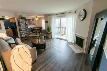 This is a picture of the living room in an upgraded 980 square foot, 2 bedroom, 1 bath model apartment at Fairfield Pointe Apartments in Fairfield, Ohio. - Photo Gallery 14