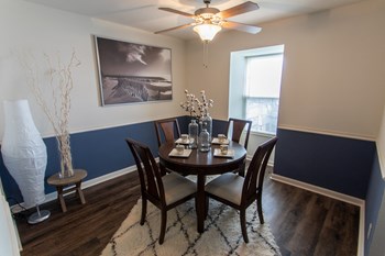 This is a picture of the dining room in an upgraded 980 square foot, 2 bedroom, 1 bath model apartment at Fairfield Pointe Apartments in Fairfield, Ohio. - Photo Gallery 17
