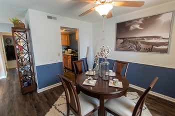 This is a picture of the dining room in an upgraded 980 square foot, 2 bedroom, 1 bath model apartment at Fairfield Pointe Apartments in Fairfield, Ohio. - Photo Gallery 18