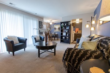This is a picture of the living room in the 980 square foot, 2 bedroom, 1 bath model apartment at Fairfield Pointe Apartments in Fairfield, Ohio. - Photo Gallery 32