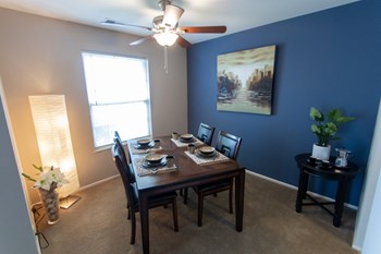 This is a picture of the dining room in the 980 square foot, 2 bedroom, 1 bath model apartment at Fairfield Pointe Apartments in Fairfield, Ohio. - Photo Gallery 34