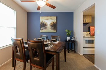 This is a picture of the dining room in the 980 square foot, 2 bedroom, 1 bath model apartment at Fairfield Pointe Apartments in Fairfield, Ohio. - Photo Gallery 33