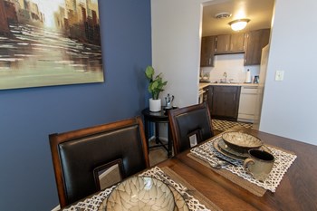 This is a picture of the dining room in the 980 square foot, 2 bedroom, 1 bath model apartment at Fairfield Pointe Apartments in Fairfield, Ohio. - Photo Gallery 35