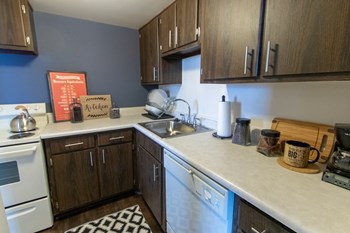 This is a picture of the kitchen in the 980 square foot, 2 bedroom, 1 bath model apartment at Fairfield Pointe Apartments in Fairfield, Ohio. - Photo Gallery 6