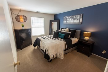 This is a picture of the primary bedroom in the 980 square foot, 2 bedroom, 1 bath model apartment at Fairfield Pointe Apartments in Fairfield, Ohio. - Photo Gallery 37