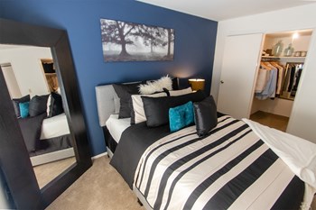 This is a picture of the primary bedroom in the 980 square foot, 2 bedroom, 1 bath model apartment at Fairfield Pointe Apartments in Fairfield, Ohio. - Photo Gallery 38