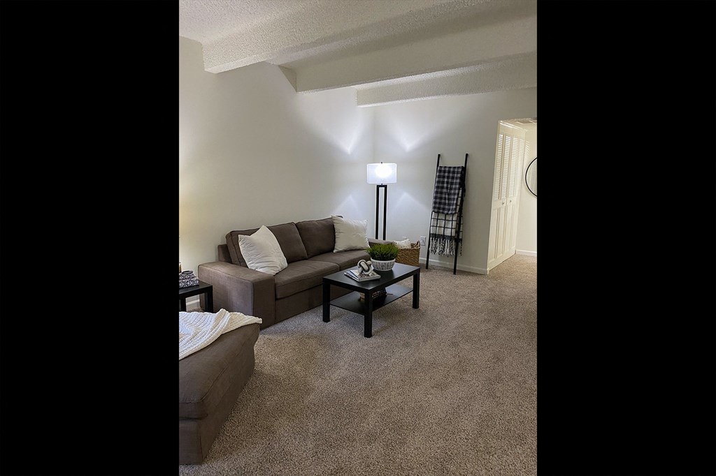 This is a photo of the living room in the 965 square foot 1 bedroom, 1 bath  apartment at Harvard Square Apartments, in the Vickery Meadow neighborhood of Dallas, TX.